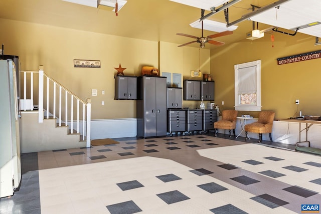 interior space featuring ceiling fan and white fridge