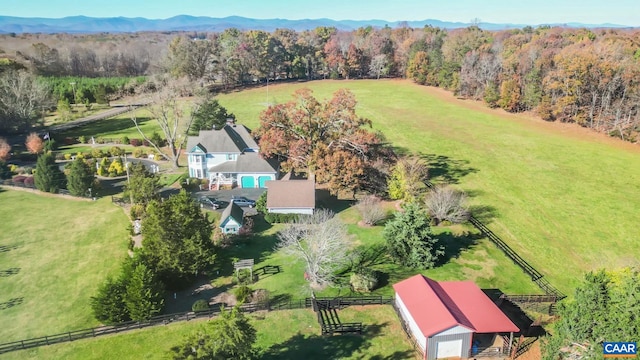 birds eye view of property with a mountain view and a rural view