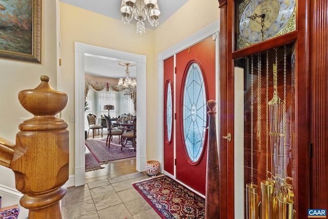 entrance foyer featuring an inviting chandelier