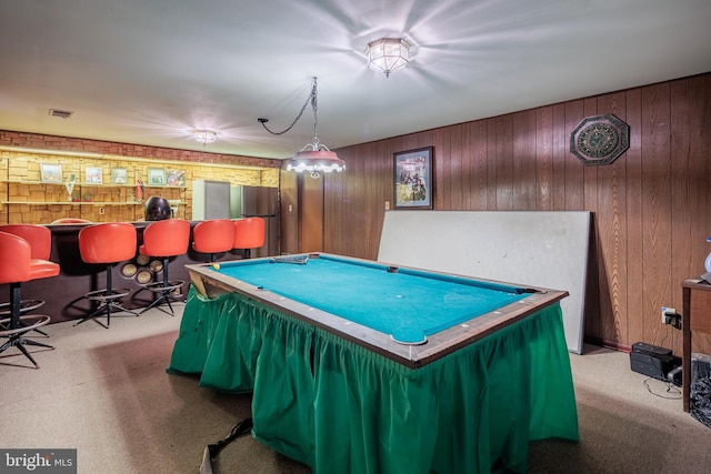 recreation room featuring carpet flooring, bar, wooden walls, and pool table