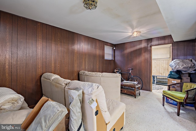 interior space with wood walls and light carpet