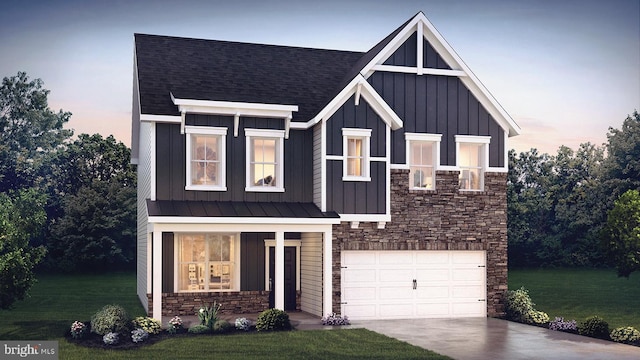 view of front of home with a lawn and a garage