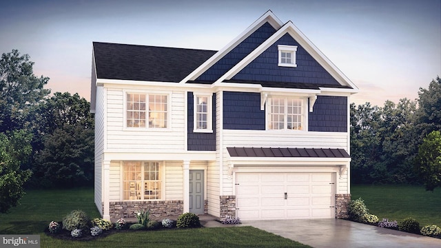 craftsman-style home featuring a lawn and a garage