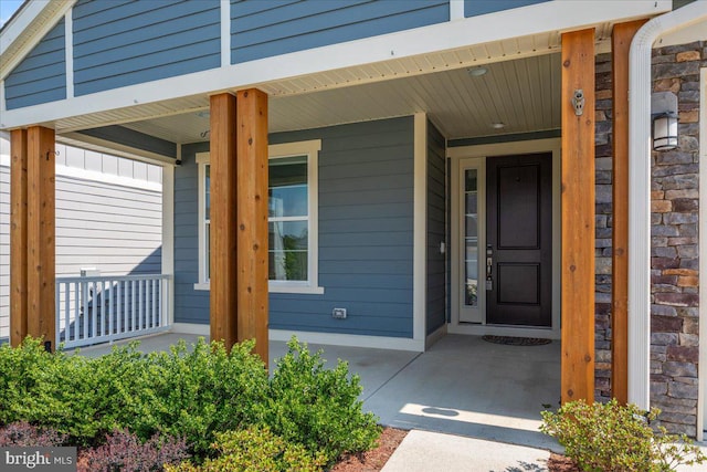 doorway to property with a porch