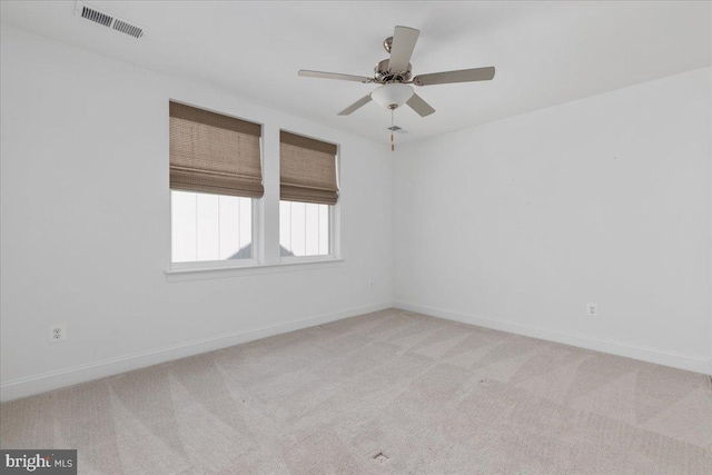 carpeted empty room with ceiling fan