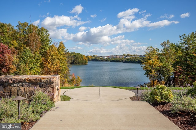 view of community with a water view