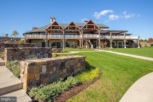 view of front of house featuring a front yard and a pergola