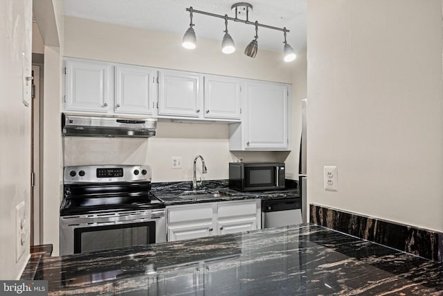 kitchen with exhaust hood, white cabinets, hanging light fixtures, sink, and appliances with stainless steel finishes