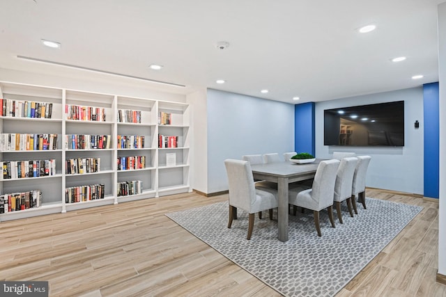 dining space featuring light wood-type flooring