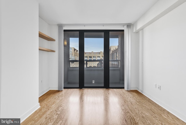 unfurnished room featuring light wood-type flooring