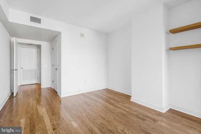 unfurnished room with light hardwood / wood-style flooring