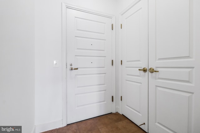 doorway to outside with tile patterned floors