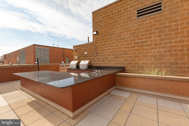 view of patio / terrace with a grill and area for grilling