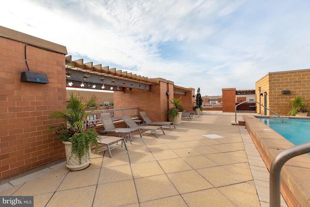 view of patio / terrace featuring a community pool