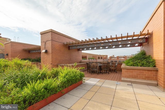 view of patio featuring a pergola and a wooden deck