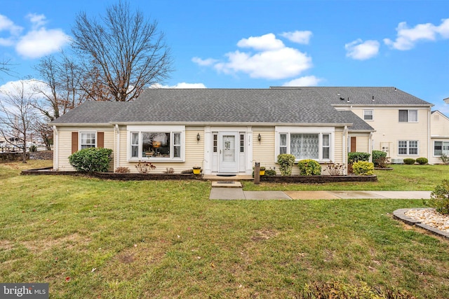 ranch-style home with a front yard