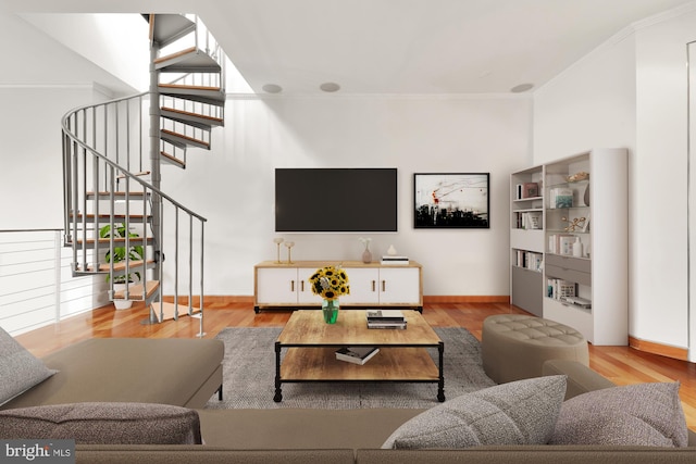 living room featuring crown molding and light hardwood / wood-style flooring