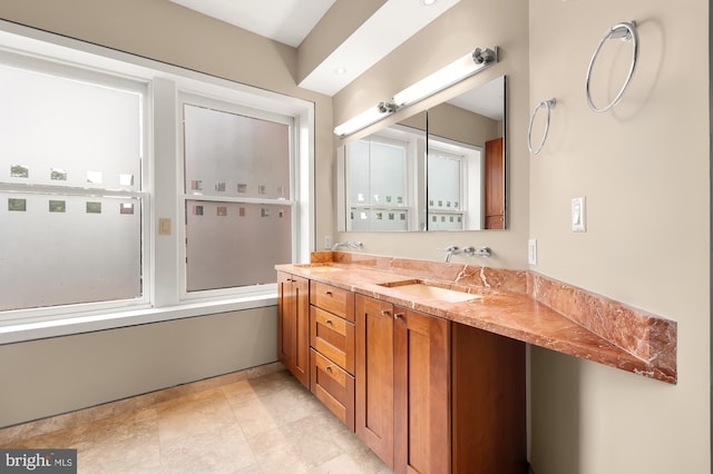 bathroom featuring vanity and combined bath / shower with glass door