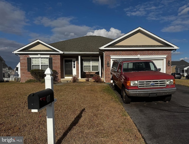 single story home with a front lawn and a garage