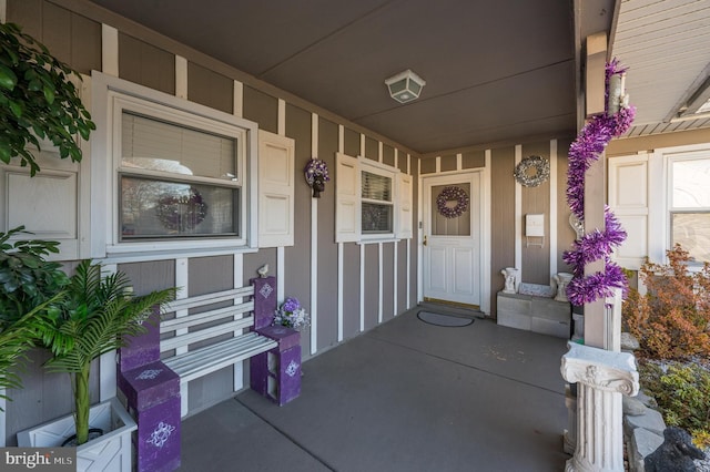 doorway to property featuring covered porch