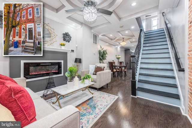 living room featuring coffered ceiling, ceiling fan, crown molding, beam ceiling, and dark hardwood / wood-style floors