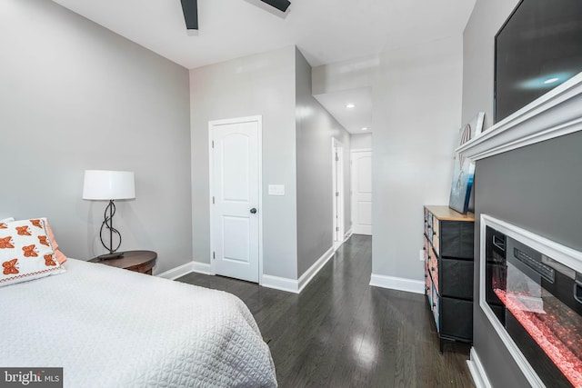 bedroom featuring ceiling fan and dark hardwood / wood-style floors