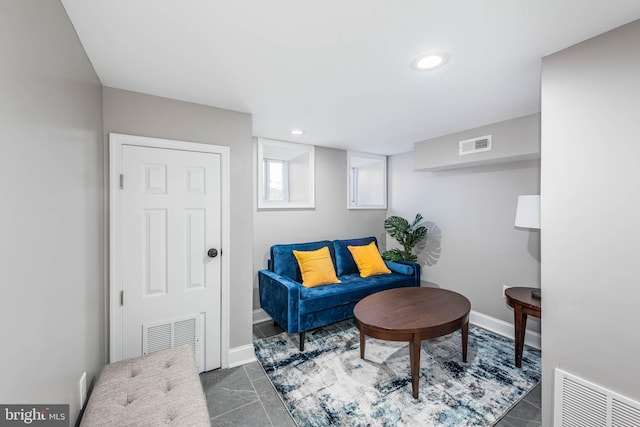 living area with dark tile patterned floors