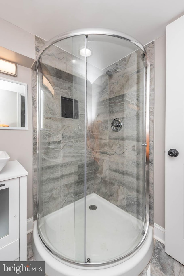 bathroom with vanity and an enclosed shower