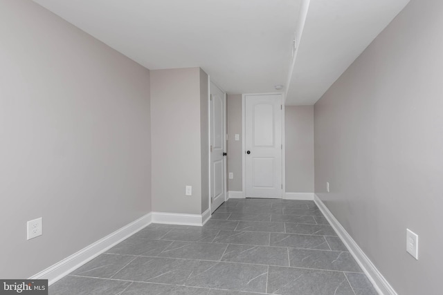 interior space with dark tile patterned flooring