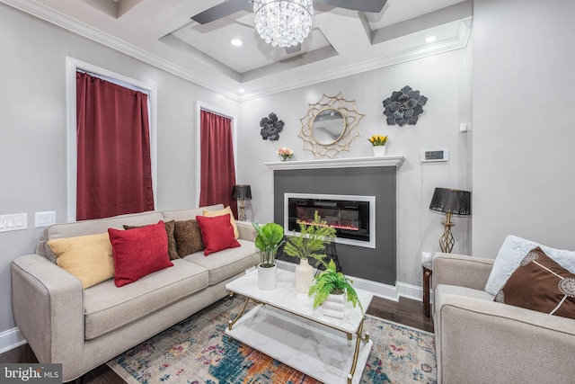 living room with dark hardwood / wood-style flooring, ornamental molding, and coffered ceiling