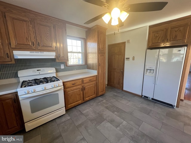 kitchen featuring ceiling fan and white appliances