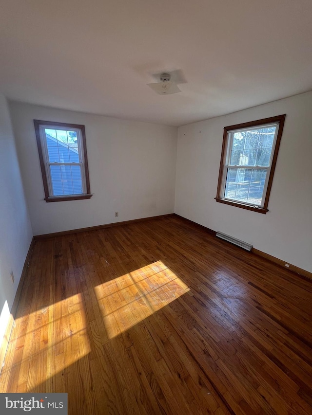 empty room featuring dark hardwood / wood-style floors