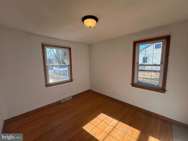 empty room featuring wood-type flooring