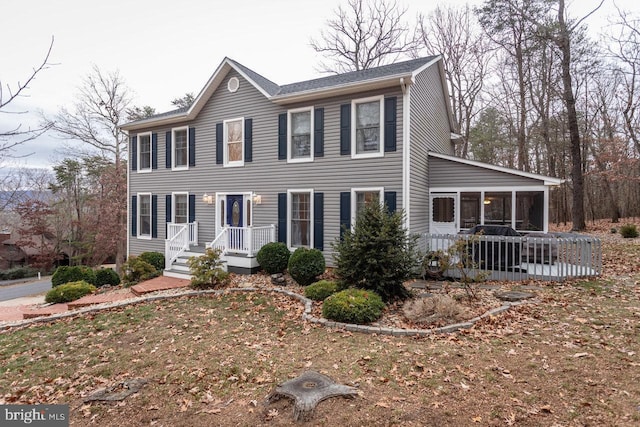 colonial-style house with a sunroom