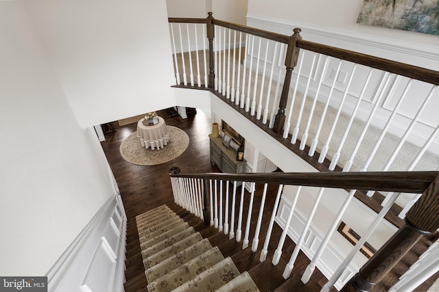 stairs featuring hardwood / wood-style flooring