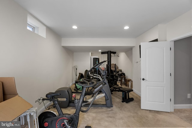 exercise area featuring light carpet