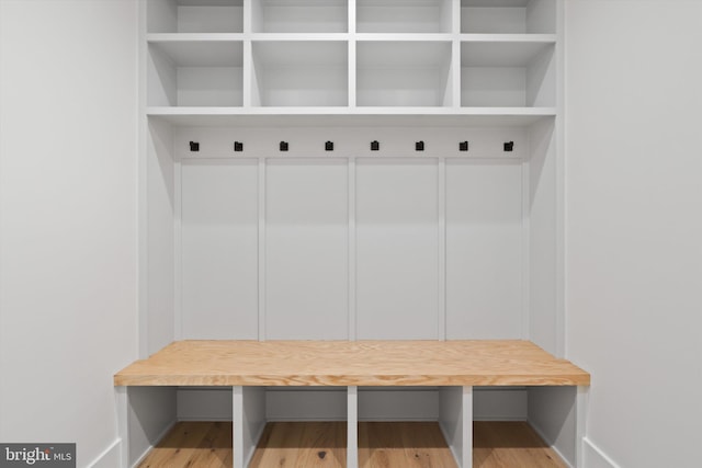 mudroom featuring hardwood / wood-style flooring and elevator