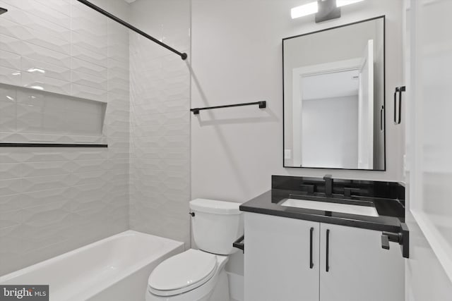 full bathroom featuring vanity, tiled shower / bath combo, and toilet