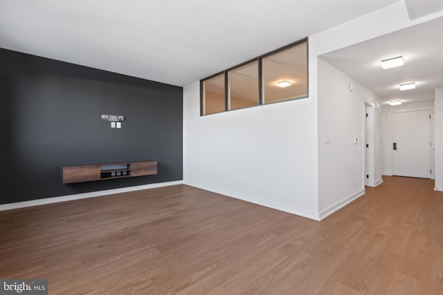 empty room with wood-type flooring