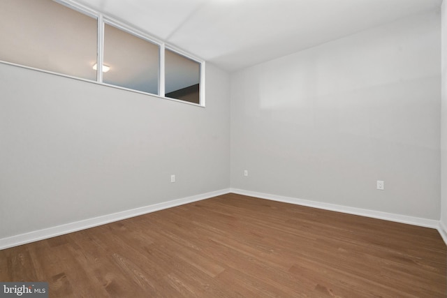 empty room featuring hardwood / wood-style flooring