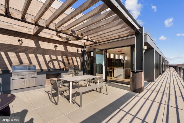 view of patio with ceiling fan, area for grilling, and a pergola