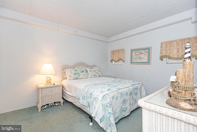 carpeted bedroom with a textured ceiling