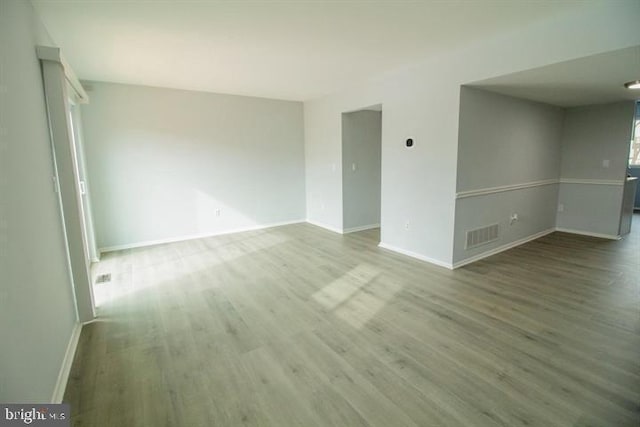 unfurnished room featuring wood-type flooring