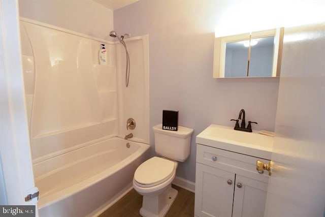 full bathroom with toilet, vanity, and washtub / shower combination