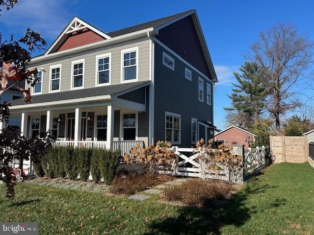 view of front of property featuring a porch and a front lawn