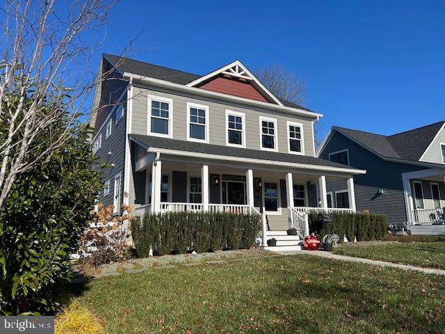 view of front of house featuring a front yard and a porch