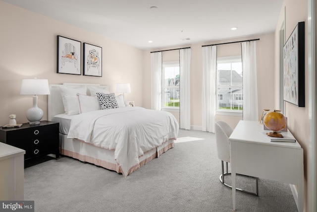 bedroom featuring light colored carpet