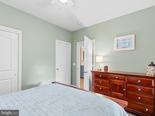 bedroom featuring hardwood / wood-style floors and ceiling fan