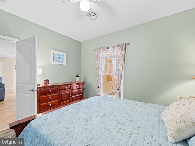 tiled bedroom with ceiling fan