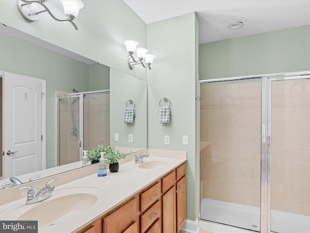 bathroom with vanity and an enclosed shower